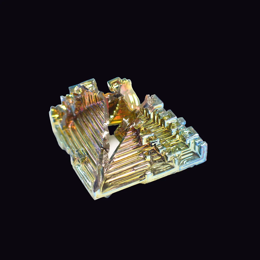 Bismuth, iridescent pink, gold, blue, green and violet on silver man-made mineral specimen