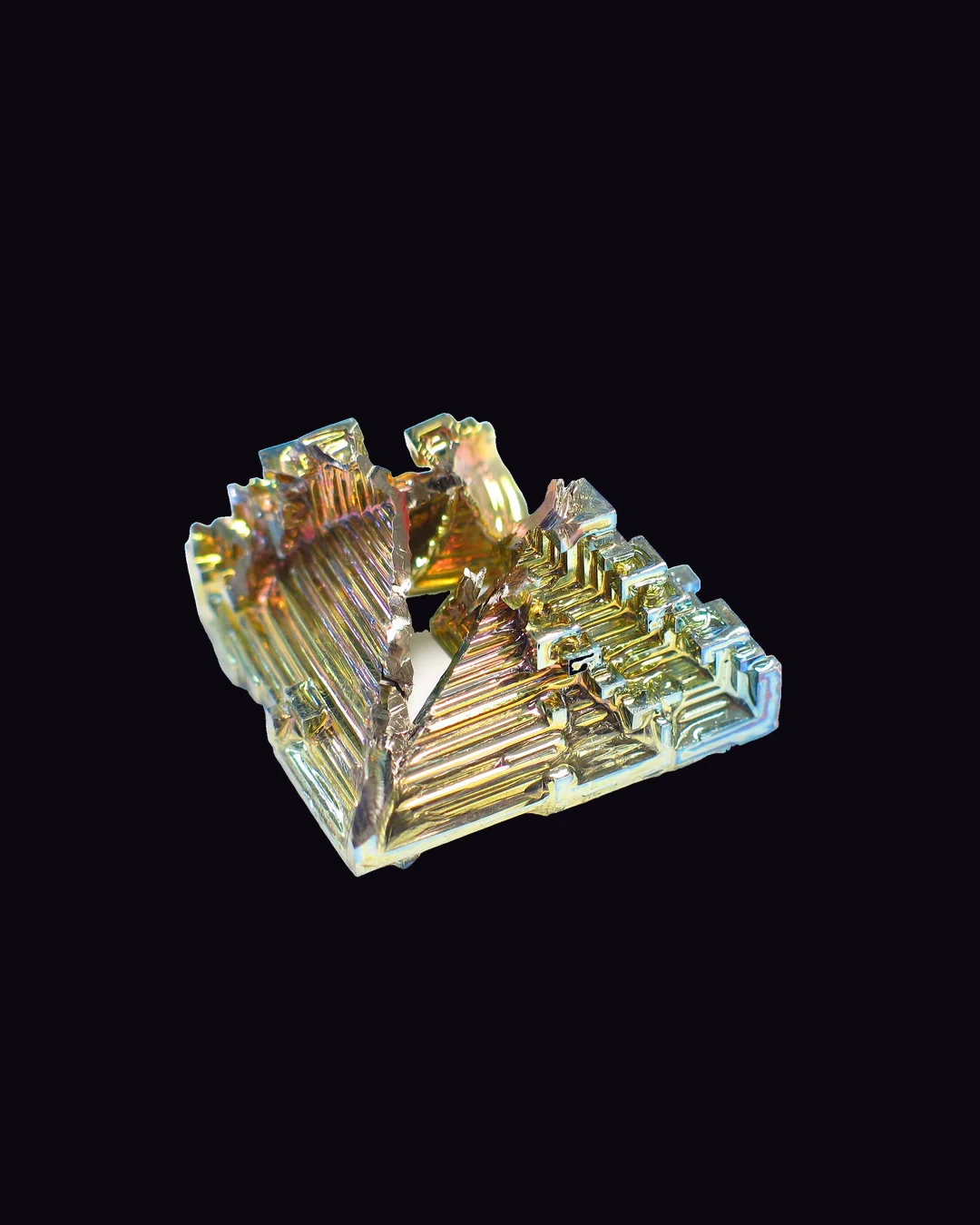 Bismuth, iridescent pink, gold, blue, green and violet on silver man-made mineral specimen
