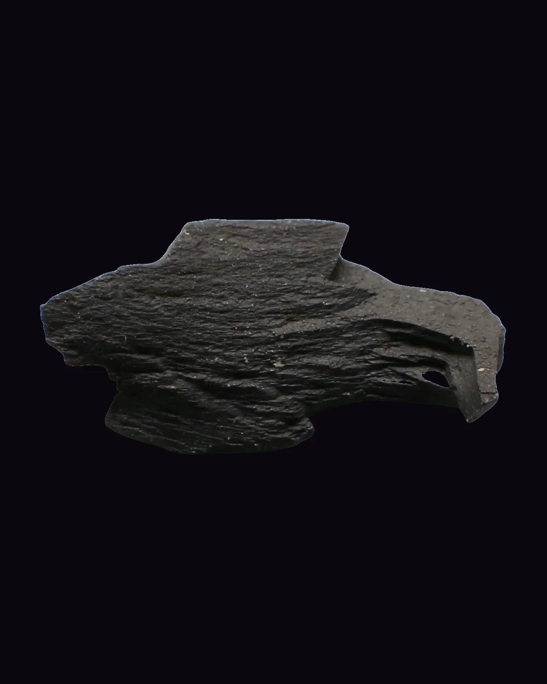 Jet, velvety black and very dark brown organic mineral specimen